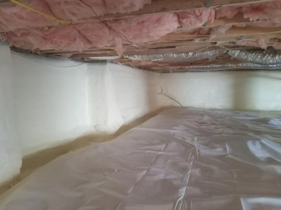Crawl space encapsulation with closed-cell spray foam for Commercial Roof Restoration in Lowell